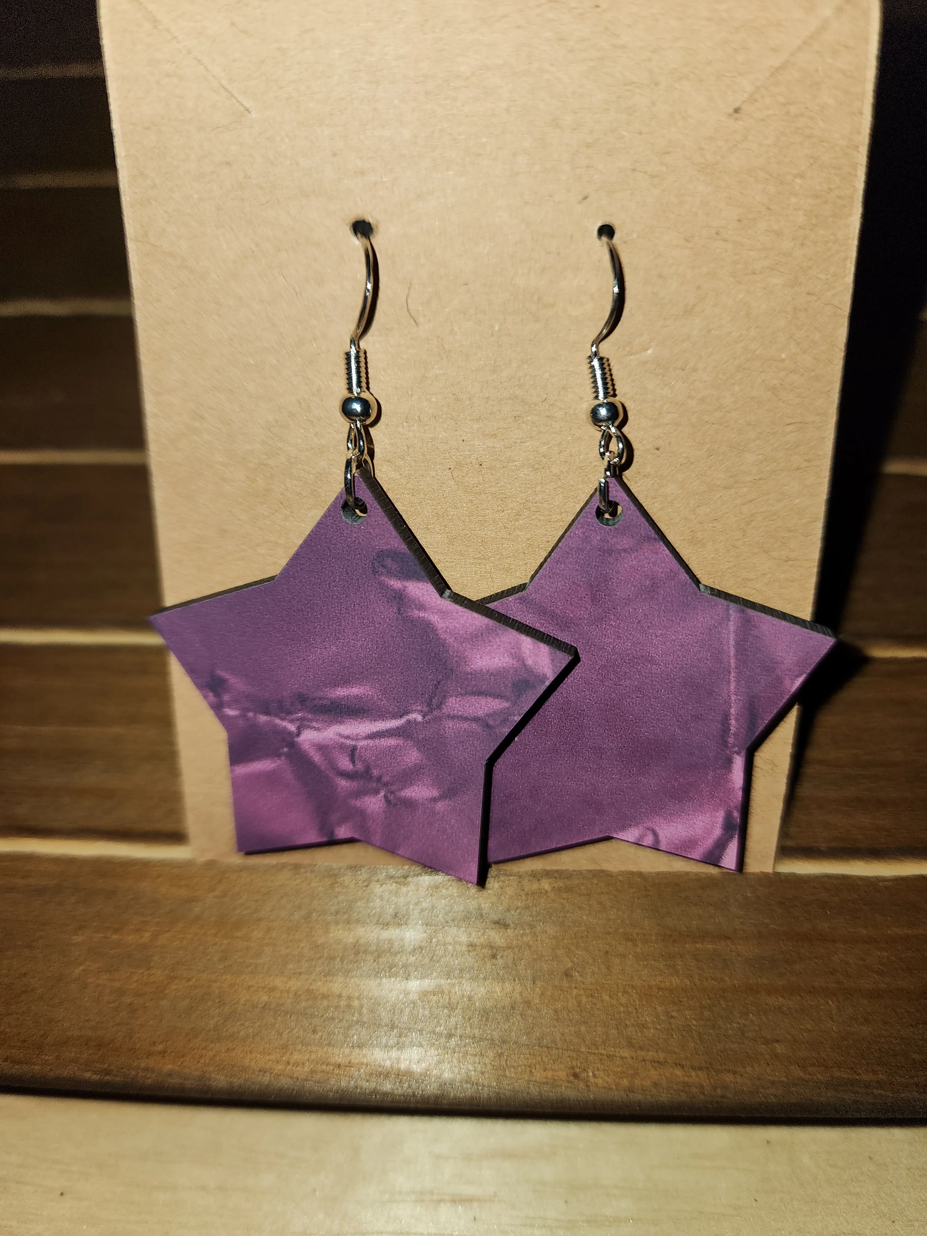 Purple star earrings